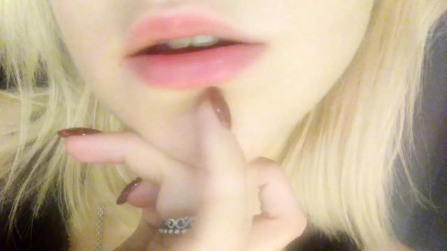 Day gentle beautiful striptease in a red dress. Close-up