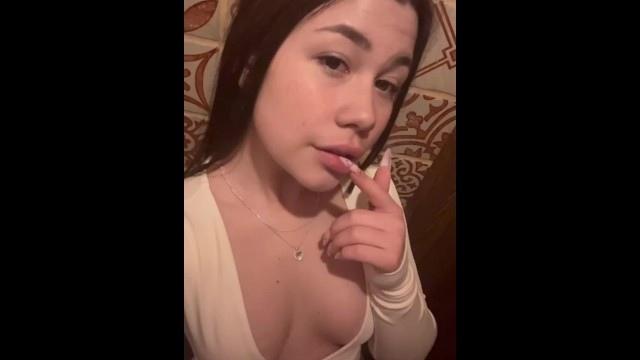 Pretty girl squeezes her breasts.